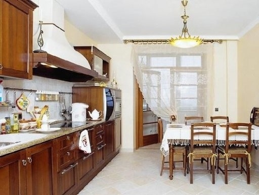 Curtains in this kitchen separate the main room from the balcony