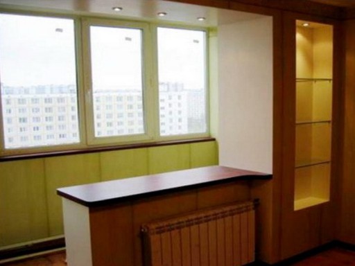 Exit to the balcony, combined with the kitchen, can become a convenient bar counter