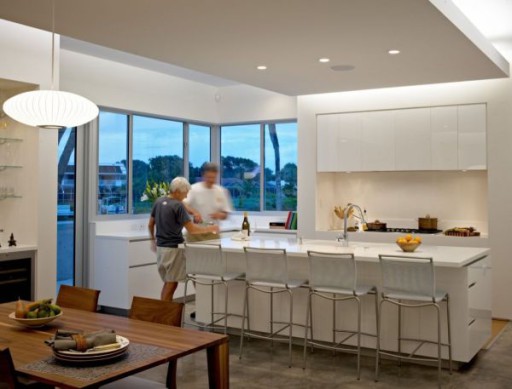 In this kitchen, a discreet official atmosphere is created, which is softened by the bar and furniture