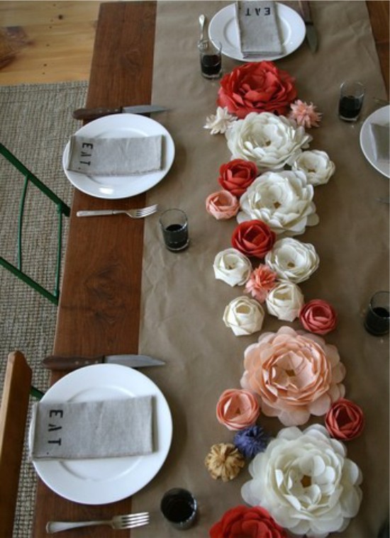 Flowers made of corrugated paper on a festive table