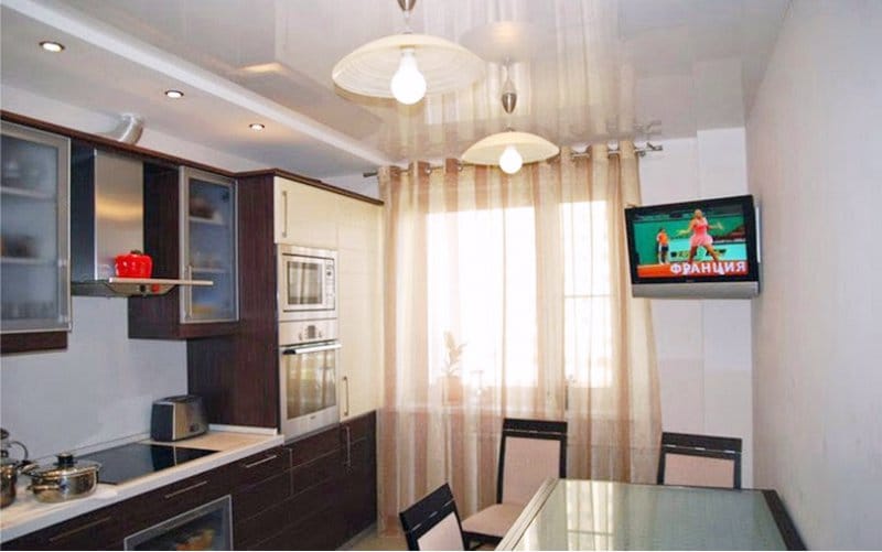 Gypsum plasterboard ceiling in the kitchen with niches and ledges