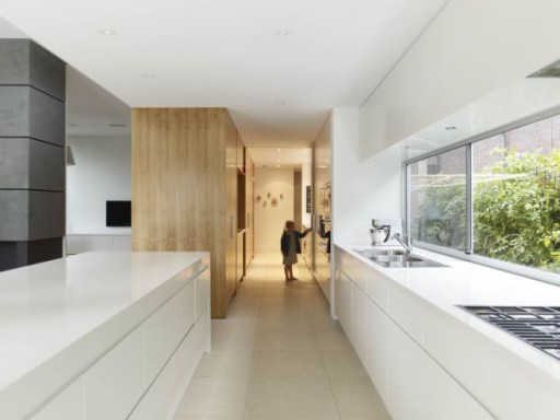 Functional design of a long narrow kitchen without decor elements looks devoid of individuality