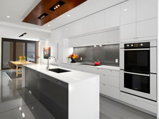 In a spacious kitchen, a white-gray island looks harmonious, especially with good lighting
